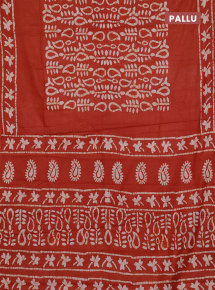 Batik cotton saree rustic orange with allover prints and batik printed border