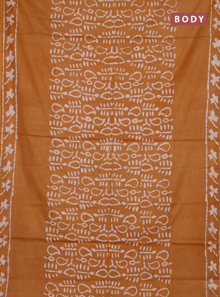 Batik cotton saree mustard yellow with allover prints and batik printed border