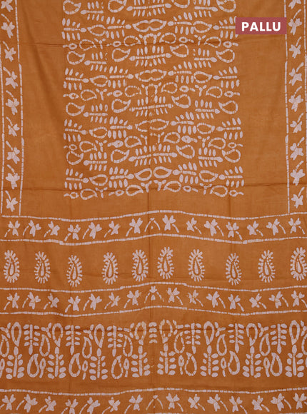 Batik cotton saree mustard yellow with allover prints and batik printed border