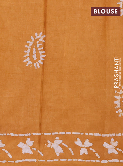 Batik cotton saree mustard yellow with allover prints and batik printed border
