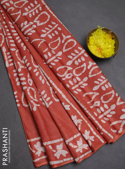 Batik cotton saree rustic orange with allover prints and batik printed border