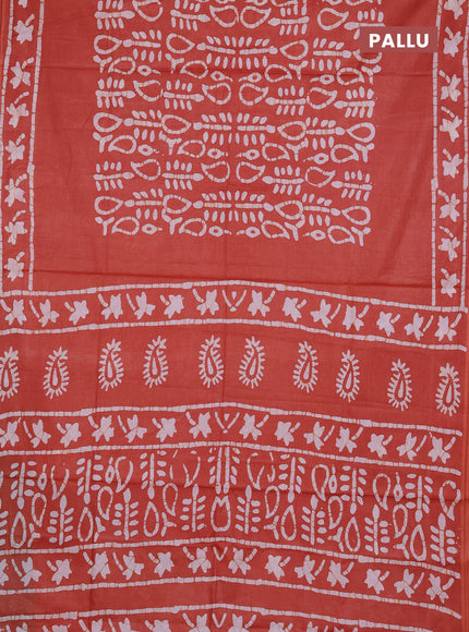 Batik cotton saree rustic orange with allover prints and batik printed border