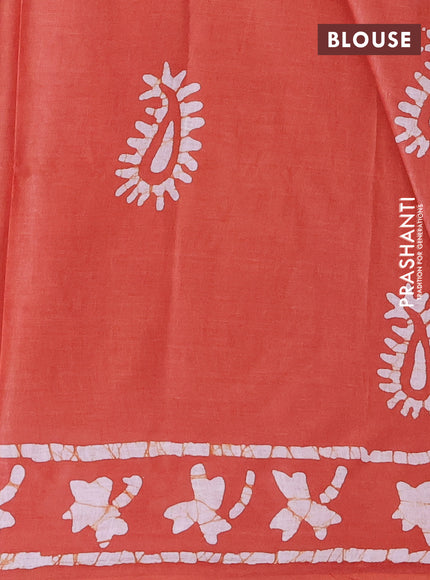 Batik cotton saree rustic orange with allover prints and batik printed border
