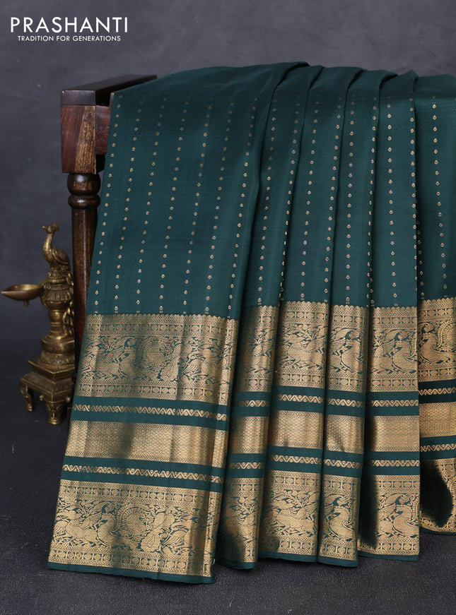 Pure kanchipuram silk saree bottle green with allover zari woven 1000 buttas and long zari woven peacock border