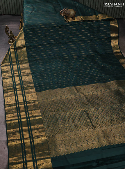 Pure kanchipuram silk saree bottle green with allover zari woven 1000 buttas and long zari woven peacock border