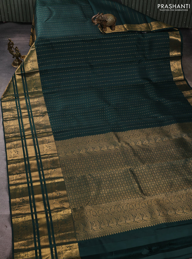 Pure kanchipuram silk saree bottle green with allover zari woven 1000 buttas and long zari woven peacock border