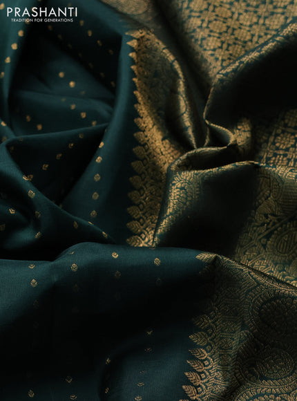 Pure kanchipuram silk saree bottle green with allover zari woven 1000 buttas and long zari woven peacock border