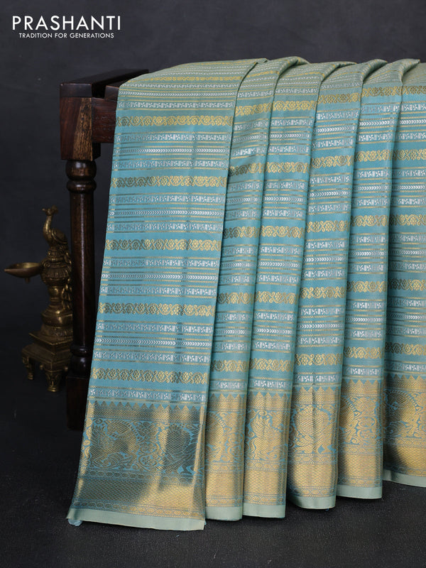 Pure kanchipuram silk saree teal with allover silver & gold zari woven veldhari weaves and rich zari woven border