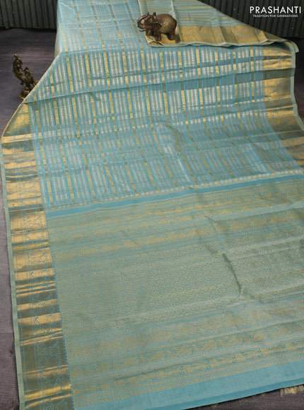 Pure kanchipuram silk saree teal with allover silver & gold zari woven veldhari weaves and rich zari woven border