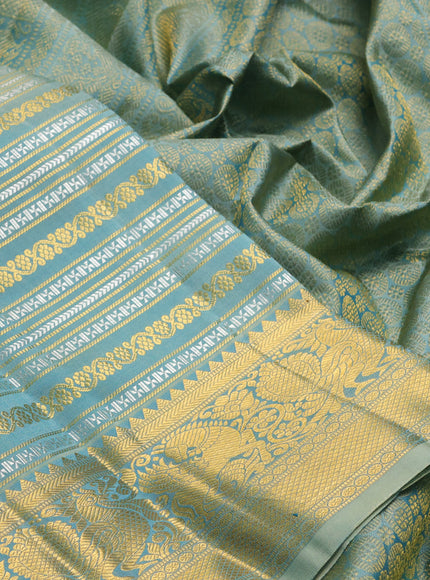 Pure kanchipuram silk saree teal with allover silver & gold zari woven veldhari weaves and rich zari woven border