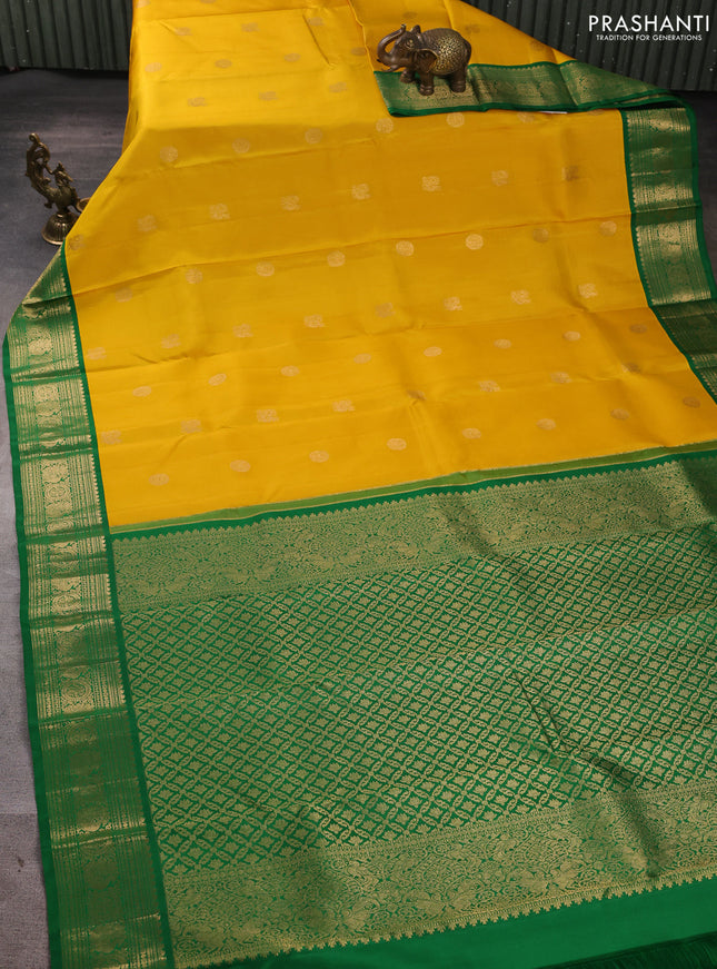 Pure kanchipuram silk saree yellow and green with annam & rudhraksha zari woven buttas and rich zari woven peacock border