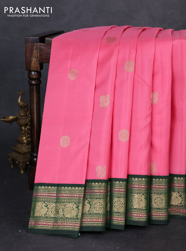 Pure kanchipuram silk saree light pink and bottle green with annam & rudhraksha zari woven buttas and rich zari woven peacock border