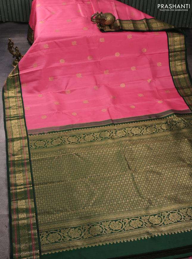 Pure kanchipuram silk saree light pink and bottle green with annam & rudhraksha zari woven buttas and rich zari woven peacock border