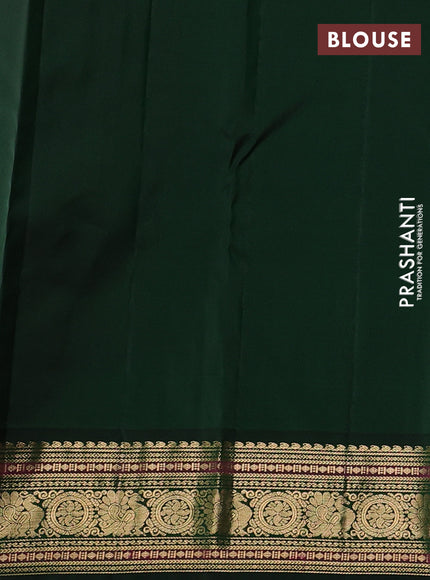 Pure kanchipuram silk saree light pink and bottle green with annam & rudhraksha zari woven buttas and rich zari woven peacock border