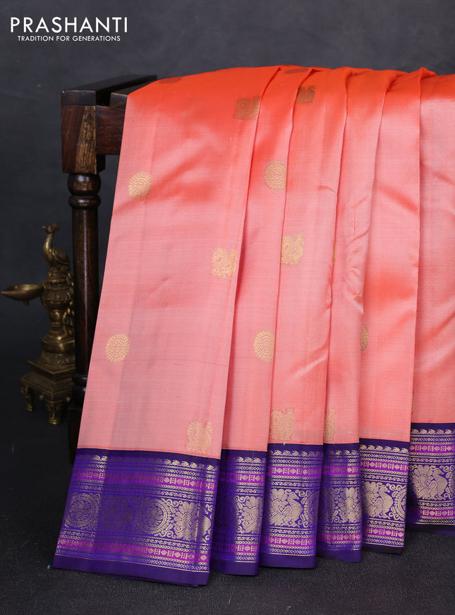 Pure kanchipuram silk saree peach orange and blue with annam & rudhraksha zari woven buttas and rich zari woven peacock border