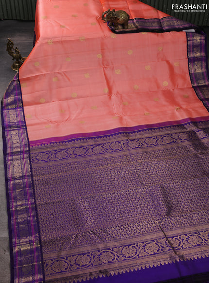 Pure kanchipuram silk saree peach orange and blue with annam & rudhraksha zari woven buttas and rich zari woven peacock border
