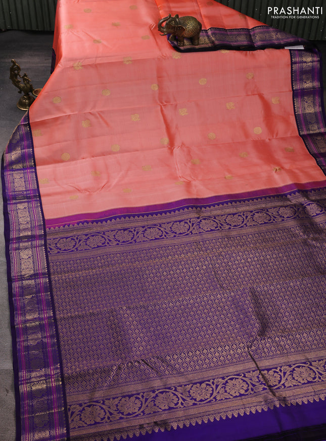 Pure kanchipuram silk saree peach orange and blue with annam & rudhraksha zari woven buttas and rich zari woven peacock border