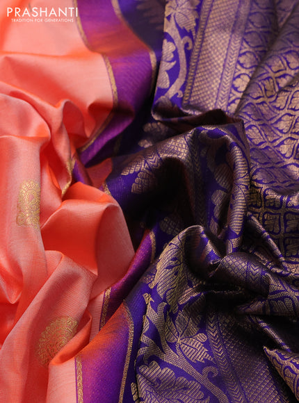 Pure kanchipuram silk saree peach orange and blue with annam & rudhraksha zari woven buttas and rich zari woven peacock border