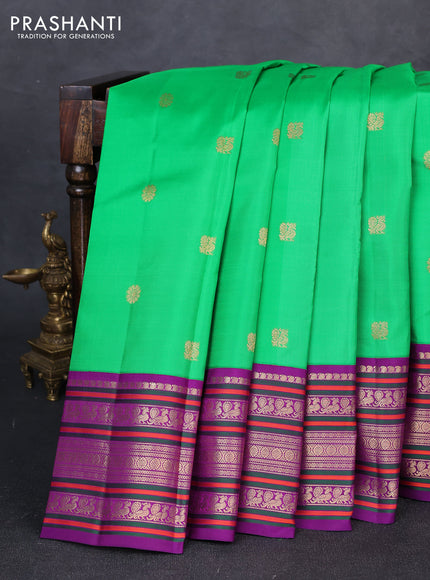 Pure kanchipuram silk saree green and purple with annam & rudhraksha zari woven buttas and long zari woven peacock border