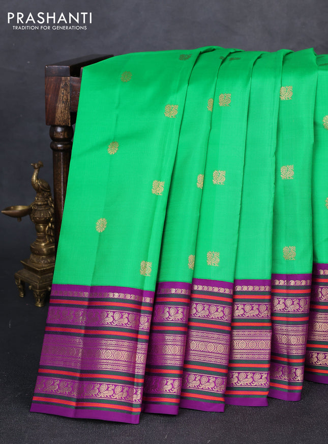 Pure kanchipuram silk saree green and purple with annam & rudhraksha zari woven buttas and long zari woven peacock border