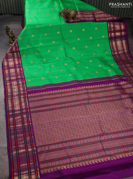 Pure kanchipuram silk saree green and purple with annam & rudhraksha zari woven buttas and long zari woven peacock border