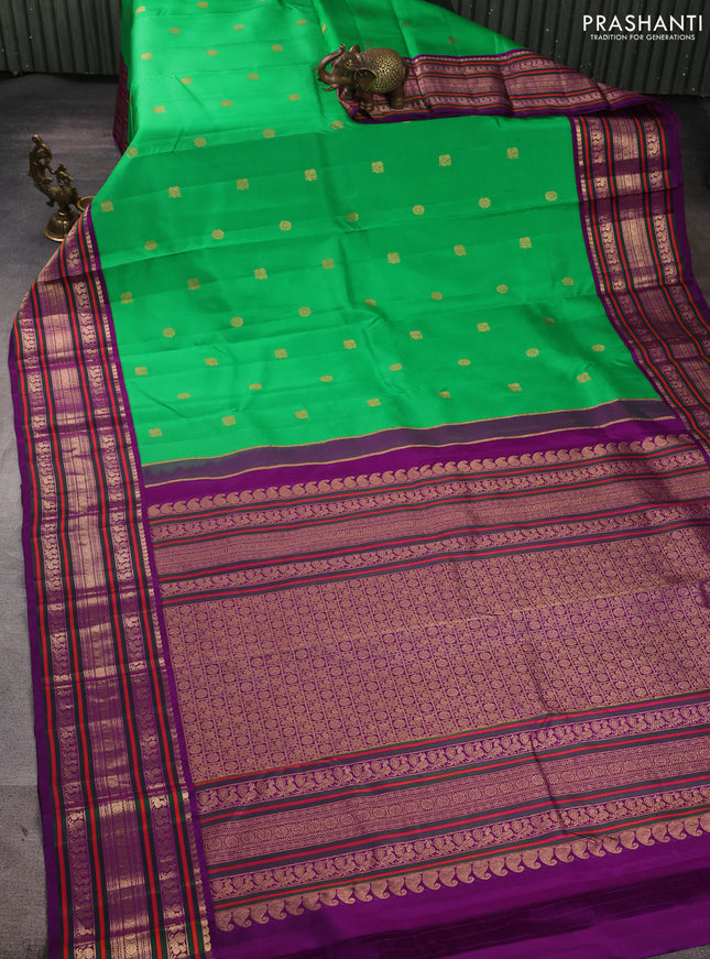 Pure kanchipuram silk saree green and purple with annam & rudhraksha zari woven buttas and long zari woven peacock border