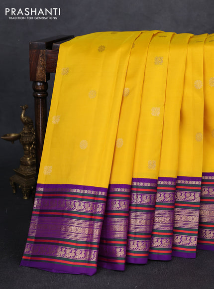 Pure kanchipuram silk saree yellow and purple with annam & rudhraksha zari woven buttas and long zari woven peacock border