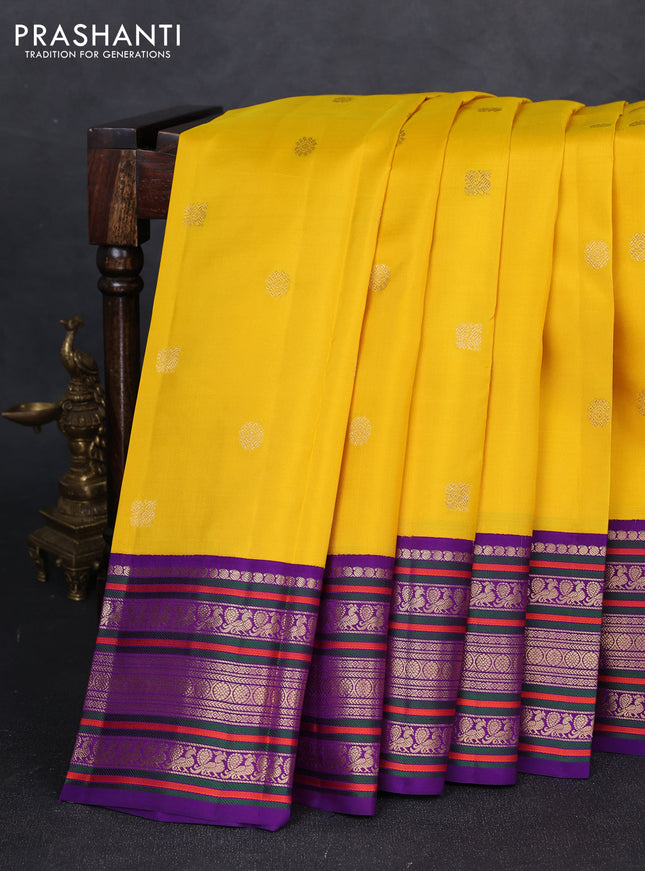 Pure kanchipuram silk saree yellow and purple with annam & rudhraksha zari woven buttas and long zari woven peacock border
