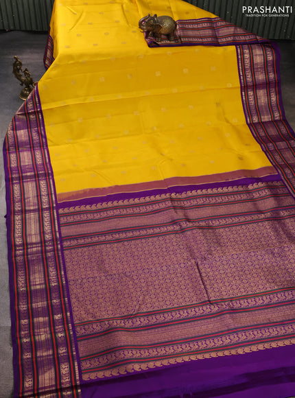 Pure kanchipuram silk saree yellow and purple with annam & rudhraksha zari woven buttas and long zari woven peacock border
