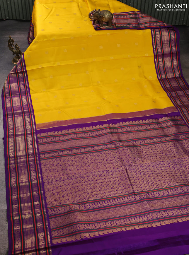 Pure kanchipuram silk saree yellow and purple with annam & rudhraksha zari woven buttas and long zari woven peacock border