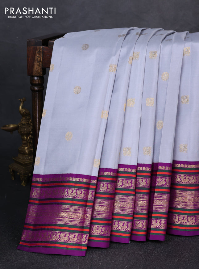 Pure kanchipuram silk saree grey shade and purple with annam & rudhraksha zari woven buttas and long zari woven peacock border