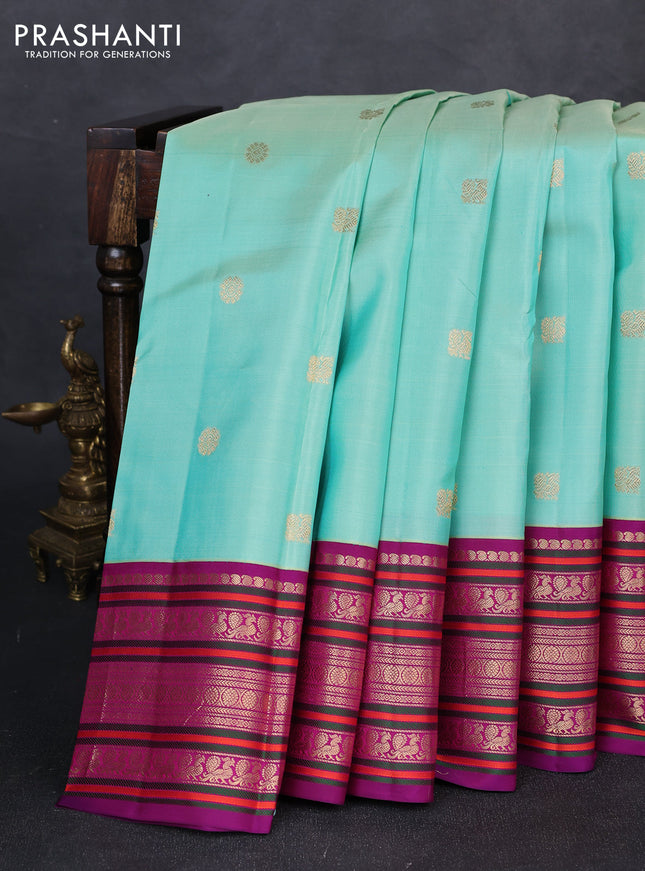 Pure kanchipuram silk saree pastel grey and purple with annam & rudhraksha zari woven buttas and long zari woven peacock border