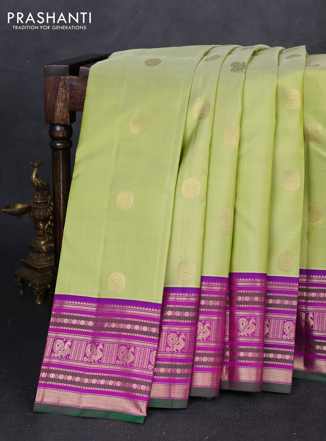 Pure kanchipuram silk saree pista green and purple with annam & rudhraksha zari woven buttas and zari woven peacock design border