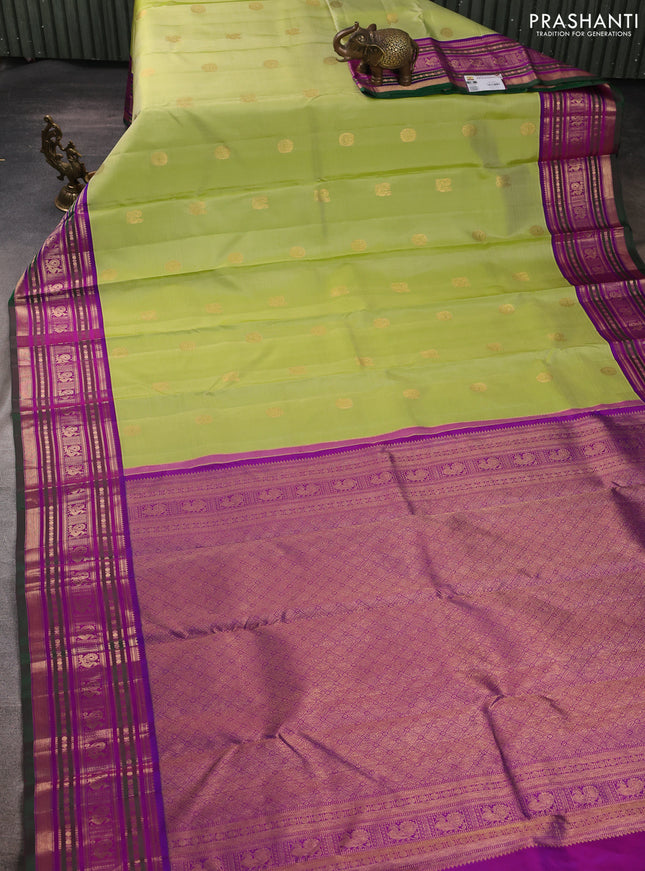 Pure kanchipuram silk saree pista green and purple with annam & rudhraksha zari woven buttas and zari woven peacock design border