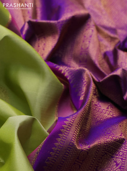 Pure kanchipuram silk saree pista green and purple with annam & rudhraksha zari woven buttas and zari woven peacock design border
