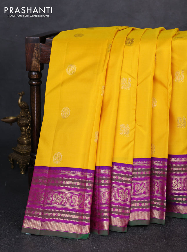 Pure kanchipuram silk saree mango yellow and purple with annam & rudhraksha zari woven buttas and zari woven peacock design border