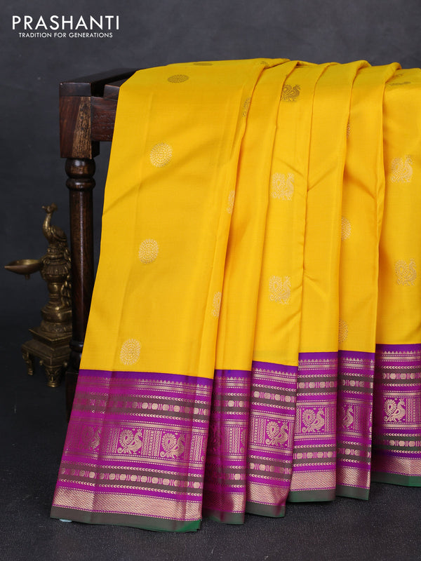 Pure kanchipuram silk saree mango yellow and purple with annam & rudhraksha zari woven buttas and zari woven peacock design border