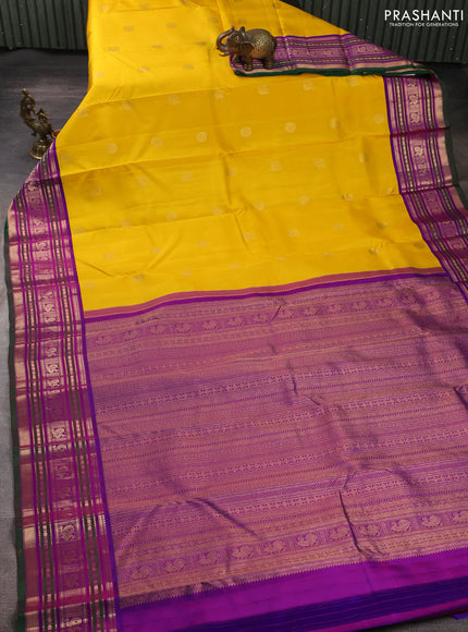 Pure kanchipuram silk saree mango yellow and purple with annam & rudhraksha zari woven buttas and zari woven peacock design border