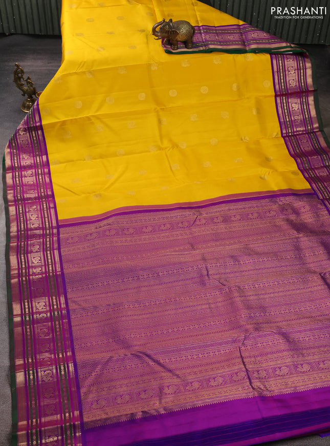 Pure kanchipuram silk saree mango yellow and purple with annam & rudhraksha zari woven buttas and zari woven peacock design border