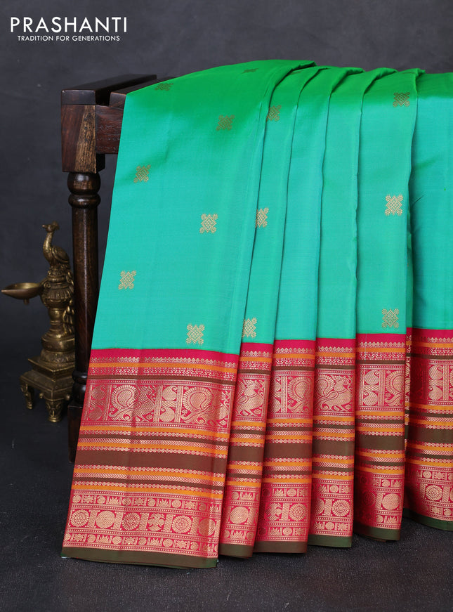 Pure kanchipuram silk saree teal green and pink with zari woven buttas and long zari woven peacock design border