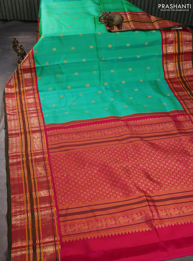 Pure kanchipuram silk saree teal green and pink with zari woven buttas and long zari woven peacock design border