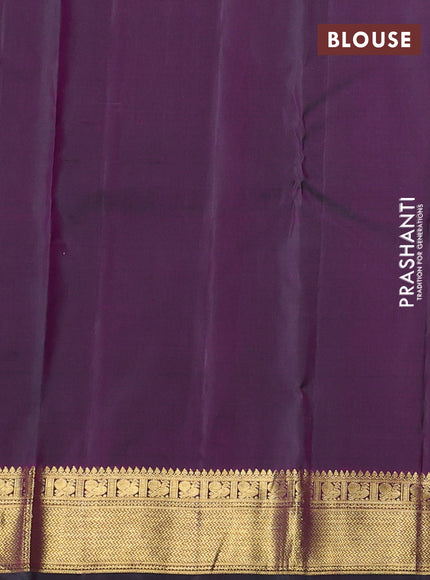 Pure kanchipuram silk saree dual shade of pinkish green with allover zari woven buttas and zari woven korvai border