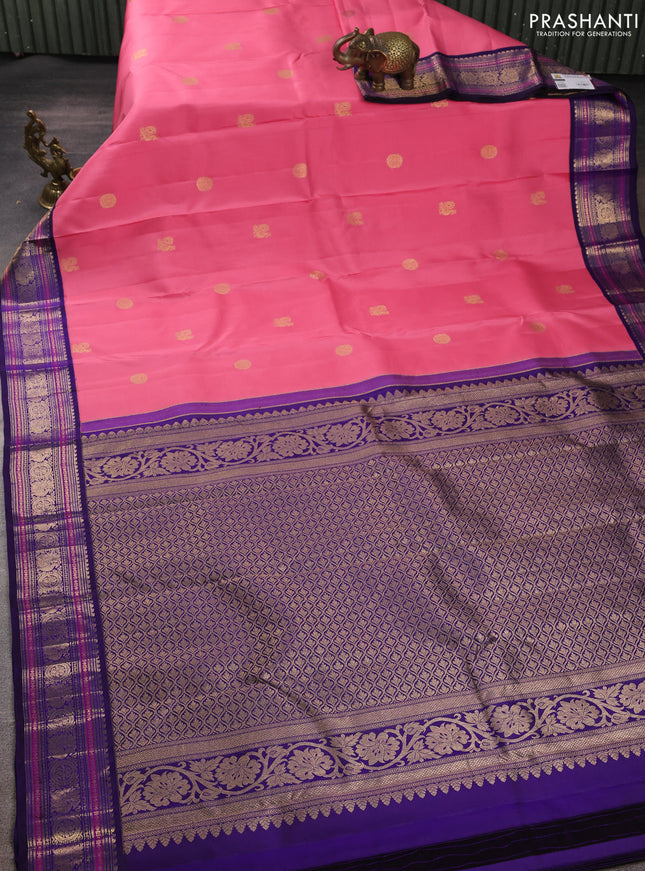 Pure kanchipuram silk saree peach pink and violet with zari woven buttas and zari woven korvai border