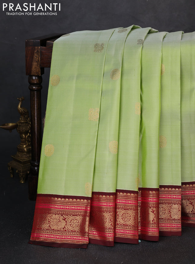 Pure kanchipuram silk saree pista green and deep maroon with annam zari woven buttas and zari woven korvai border