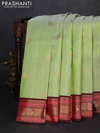 Pure kanchipuram silk saree pista green and deep maroon with annam zari woven buttas and zari woven korvai border