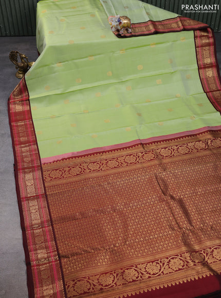 Pure kanchipuram silk saree pista green and deep maroon with annam zari woven buttas and zari woven korvai border
