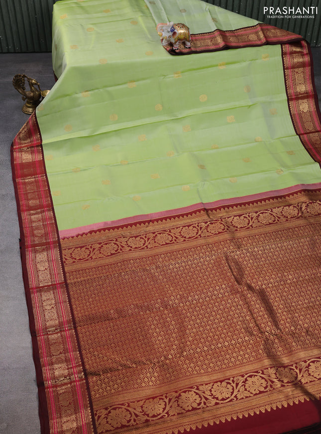 Pure kanchipuram silk saree pista green and deep maroon with annam zari woven buttas and zari woven korvai border