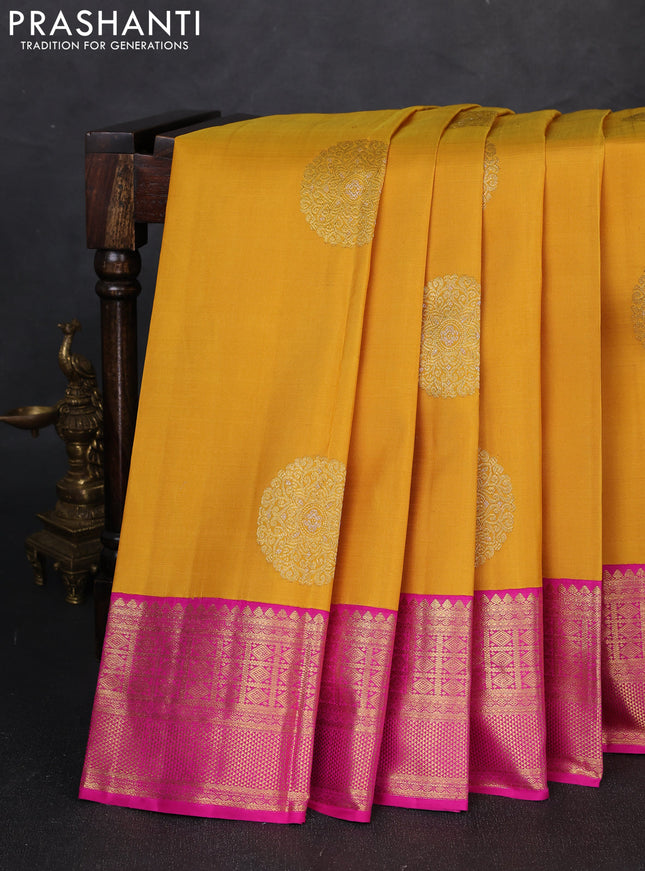 Pure kanchipuram silk saree mustard yellow and pink with zari woven buttas and zari woven korvai border