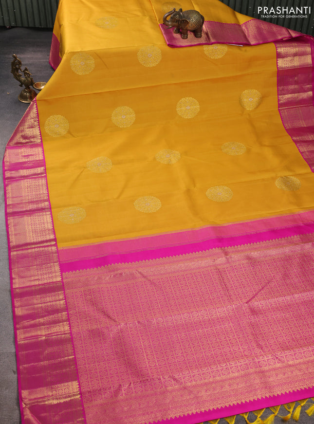 Pure kanchipuram silk saree mustard yellow and pink with zari woven buttas and zari woven korvai border