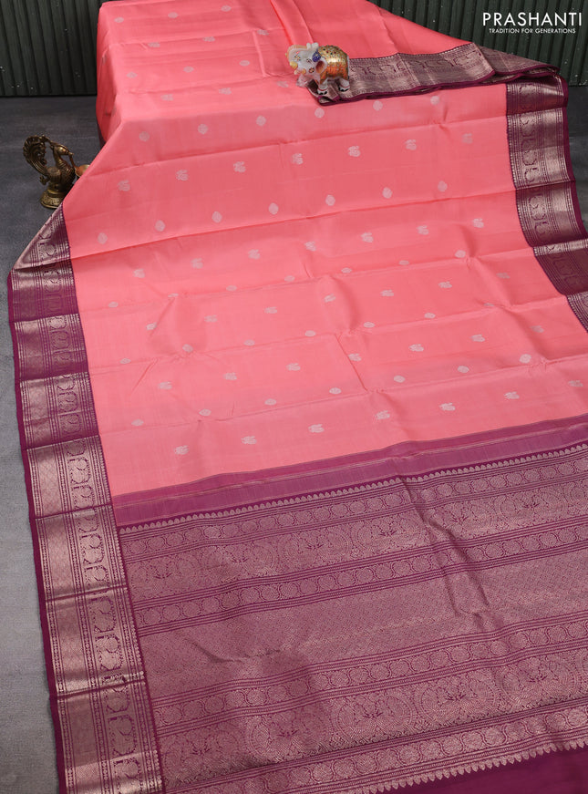 Pure kanchipuram silk saree peach pink and wine shade with zari woven buttas and zari woven korvai border